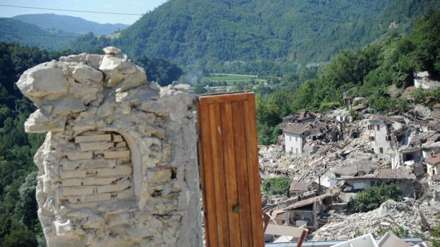 A door of a destroyed building in Pescara del Tronto, Italy