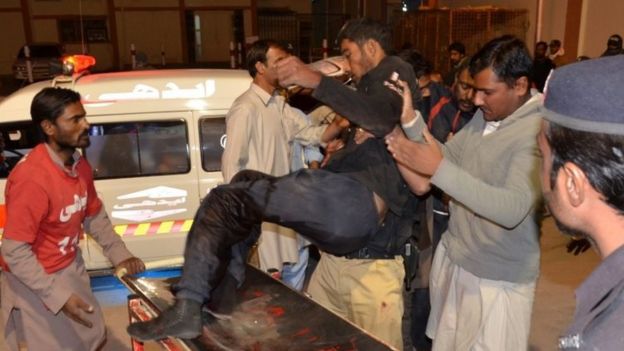 Medics take an injured police cadet to Quetta hospital. Photo: 24 October 2016