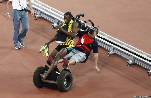 Cameraman drives into runner Usain Bolt