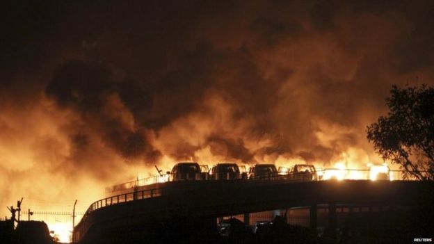 Vehicles can be seen burning at Binhai after huge explosions 12/08/2015