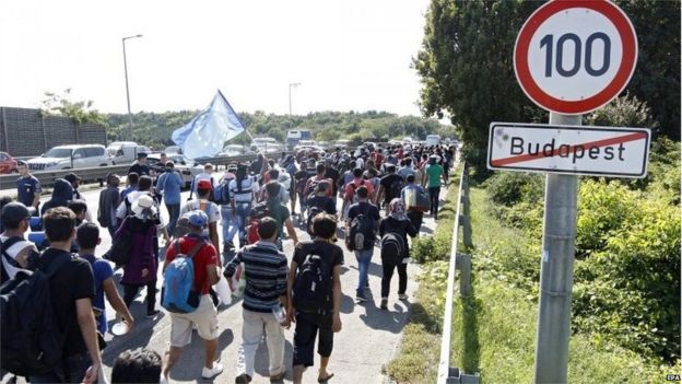 Migrants cross the city limits of Budapest, Hungary (4 September 2015)
