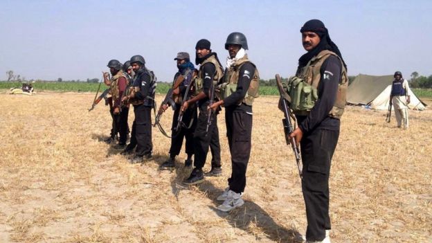 Pakistani policemen pose as they prepare to take part in an operation against alleged criminals in Rajanpur district in southern Punjab province