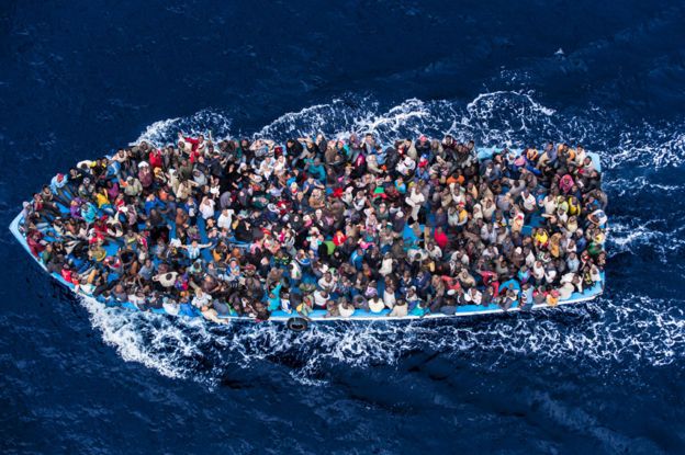 Migrants on a boat near the Libyan coast