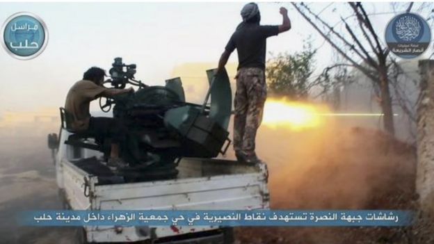 Fighters from the Nusra Front fire their weapons against Syrian government forces at the western Zahra neighborhood in Aleppo city (07 July 2015)