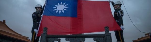 Honor guards prepare to raise the Republic of China's flag, Taiwan's official name, in the Chiang Kai-shek Memorial Hall square in Taipei, Taiwan, 12 January 2016