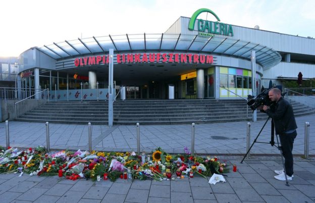 Flowers laid in front of the Olympia shopping mall in Munich, Germany, 23 July