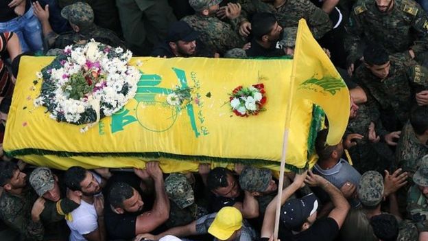 Members of Lebanon's Shia movement Hezbollah carry the coffin of a comrade killed in fighting near Zabadani
