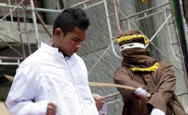 A man is caned for violating Sharia law