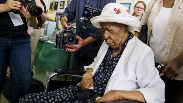 Susannah Mushatt Jones is wheeled into a celebration for her 116th birthday with family members, local dignitaries, and friends on 7 July 2015.