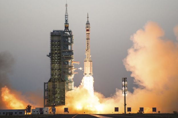 China's Shenzhou 11 spaceship onboard a Long March-2F carrier rocket takes off from the Jiuquan Satellite Launch Center in northwest China's Gansu province on Monday Oct. 17, 2016.
