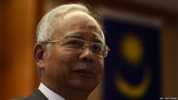 Malaysian Prime Minister Najib Razak looks on during a meeting for new government interns at the Prime Minister