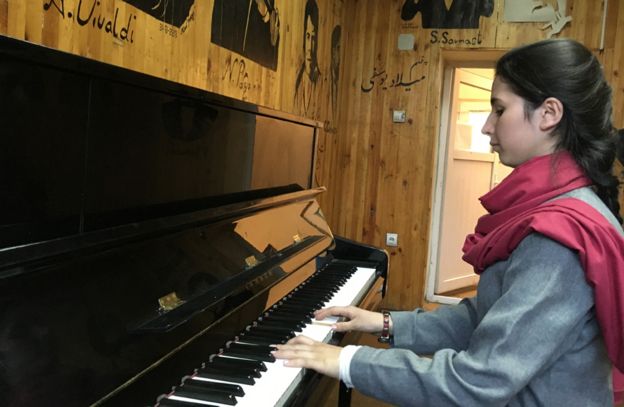  86345658 playingpiano - Afghanistan's  First  Female  Conductor