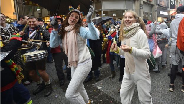 Two young women taking part in carnival celebrations