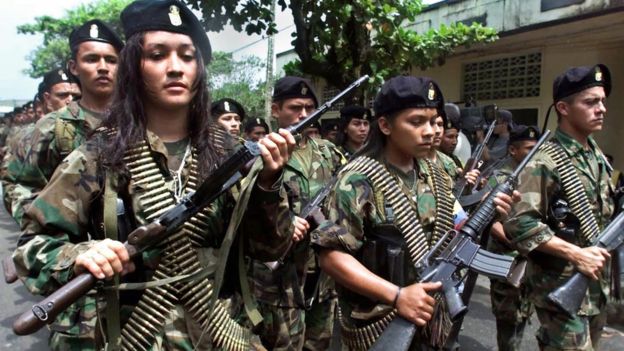 Guerrillas of the Marxist Revolutionary Armed Forces of Colombia (FARC) march in a military parade 07 February 2001 in San Vicente.