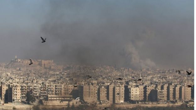 Smoke rises from a rebel-held area of Aleppo, Syria on 9 December 2016