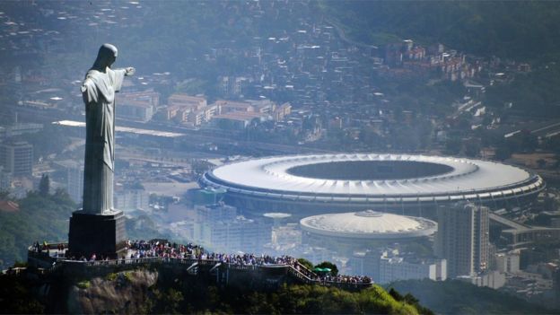 Aerial view of the Christ the Redeemer statue atop Corcovado Hill and the Mario Filho (Maracana) stadium in Rio de Janeiro, Brazil on May 10, 2013.