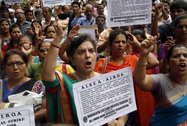 Indian government and bank employees shout slogans as they participates in a protest during a nationwide strike called by trade unions in Mumbai, India, Friday, Sept. 02, 2016.