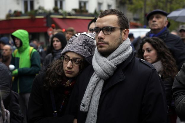 People gather outside the security perimeter set around the Bataclan concert hall in Paris, France, 13 November