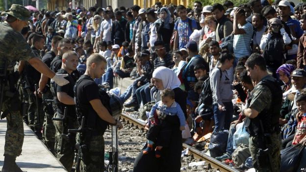 Migrants and police at station in Gevgelija, 23 August 2015