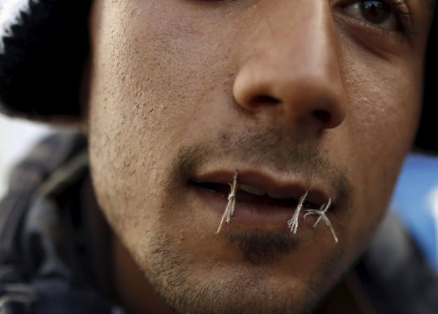 Yosri Adjili, 25, who is unemployed, goes on a hunger strike with his mouth sewed during a sit-in protest to get jobs, at the local government office courtyard in Kasserine, Tunisia, January 27, 2016
