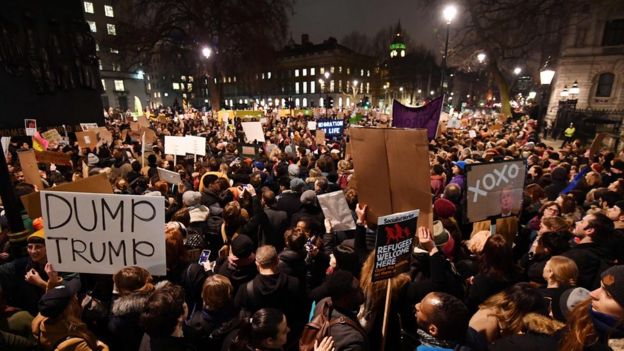 Demonstrators protest outside Downing Street against US President Donald Trump in central London on January 30, 201