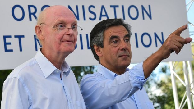 This file photo taken on August 28, 2016 shows former French Prime Minister and then candidate for the right-wing Les Republicains (LR) party primary ahead of the 2017 presidential election Francois Fillon (R) pointing a finger next to his campaign director Patrick Stefanini during a meeting with supporters Sable-sur-Sarthe, western France.