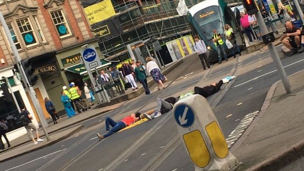 Protesters lying down in the road