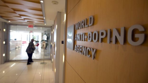 A woman walks into the head office of the World Anti-Doping Agency (WADA) in Montreal, Quebec, Canada November 9, 2015