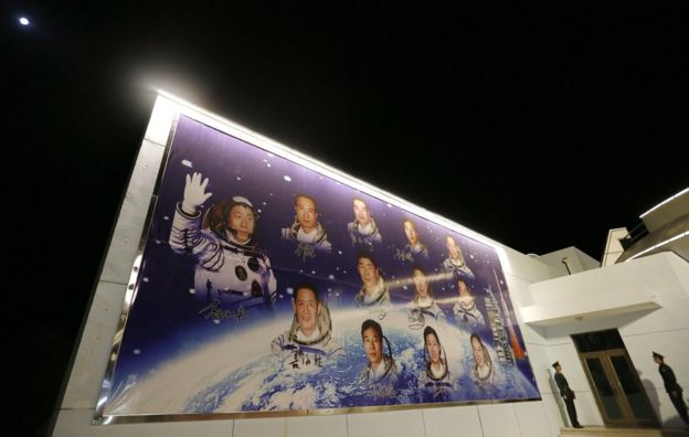 A poster on a wall showing Chinese astronauts is seen at the venue of a farewell ceremony for astronauts before the launch of the Shenzhou-11 spacecraft at the Jiuquan Satellite Launch Center in Jiuquan, Gansu province, China, 17 October 2016