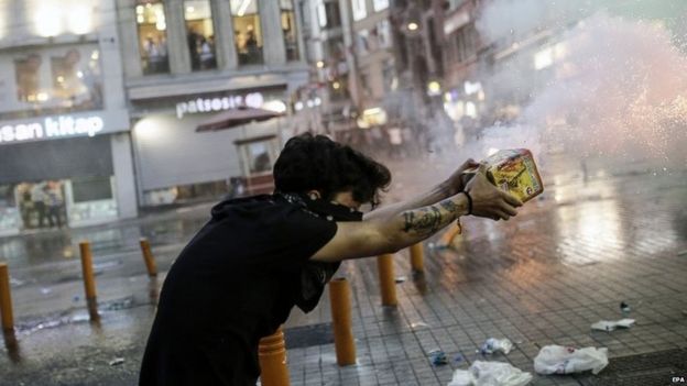 Protesters throw fireworks at Turkish riot policemen firing rubber bullets to disperse them during a demonstration 20 July 2015