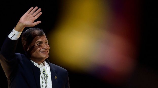 Ecuadorean President Rafael Correa waves to his audience
