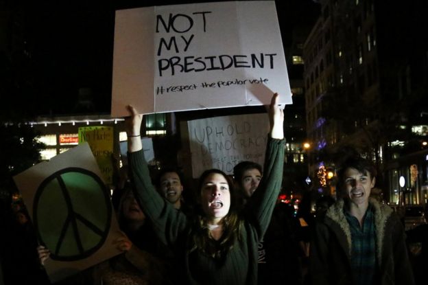 Demonstrators shout slogans at a protest in Union Square against President-elect Donald Trump in Manhattan, New York, 10 November