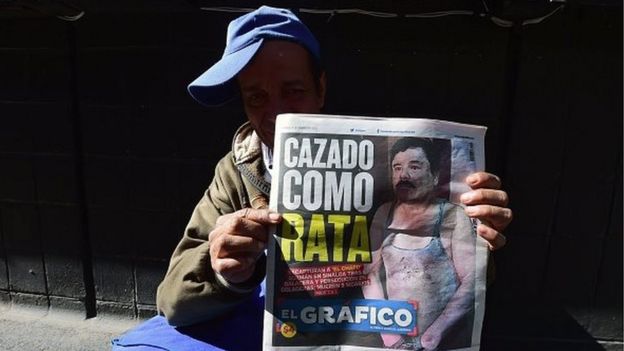 A street vendor shows a newspaper in Mexico City with a picture of drug kingpin Joaquin 'El Chapo' Guzman on its front page