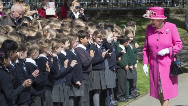 Queen speaking with school children