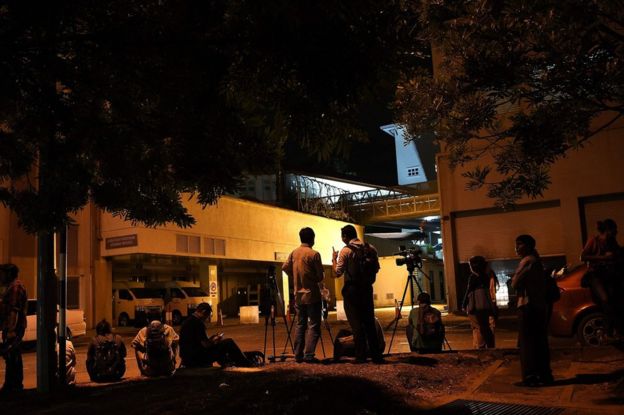 Malaysian journalists gather outside the forensics department at Putrajaya Hospital in Putrajaya, 14 February