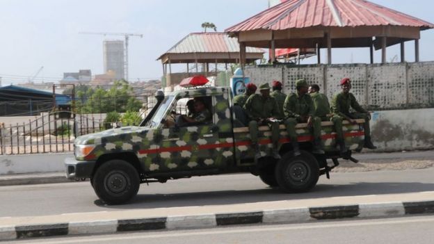 Somali government soldiers on a Military vehicle are seen outside the SYL hotel in Mogadishu on December 11, 2019