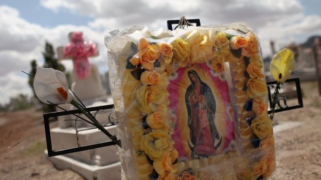 Graves are seen in a cemetery in a poor Juarez neighbourhood where many of the deceased are victims of violent crime