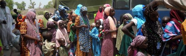 Women and children rescued from Boko Haram during military operations leave the Malkohi camp outside the Adamawa state capital, Yola, in north-east Nigeria, 25 May 2015