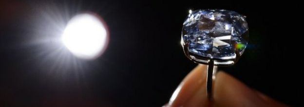 A model holds the rare blue diamond