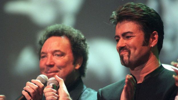 File photo dated 11/04/99 of Tom Jones (left) and George Michael performing a duet during a tribute concert to Sir Paul McCartney