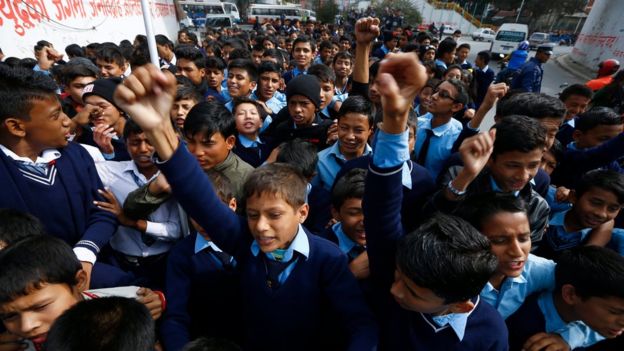 Nepalese school children shout anti India slogan during a protest rally in Kathmandu, Nepal. 24 November 2015