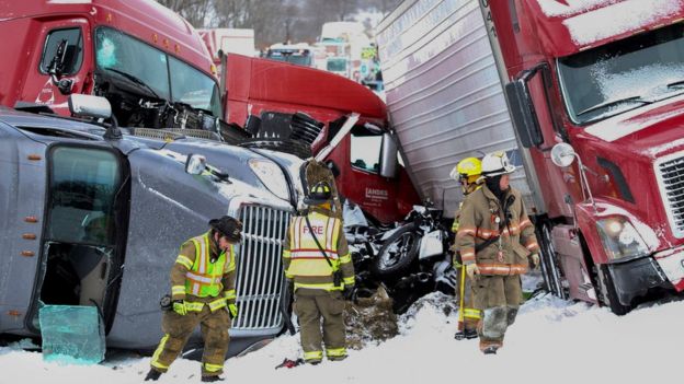 Emergency personnel work at the scene of a crash near Fredericksburg, Pa., Saturday, Feb. 13, 2016.