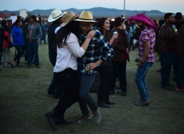 People attend the 15th birthday party celebrations of Rubi Ibarra on December 26, 2016 in Villa Guadalupe, San Luis Potosi State, Mexico
