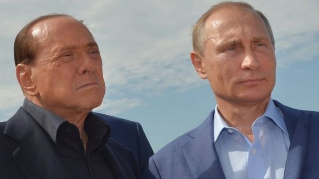 Russian President Vladimir Putin (right) and former Italian Prime Minister Silvio Berlusconi visit an Italian war cemetery near the Black Sea port of Sevastopol (11 September 2015)