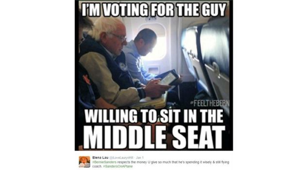 Sanders sitting on a flight in coach