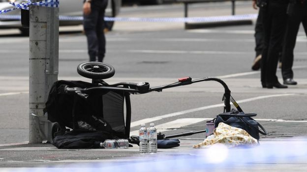 Overturned pram at scene where car struck pedestrians in Melbourne