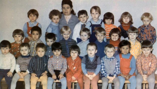 Farhiya as a child with her classmates (front row, second from right)