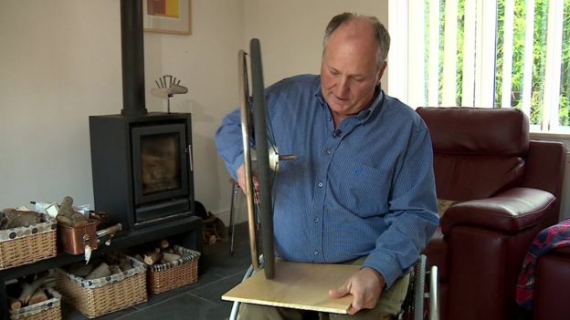 Fred Walden demonstrates how his wheels are specially made not to mark floors