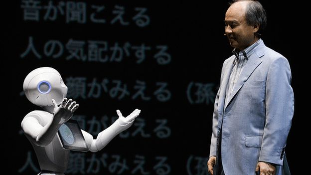 SoftBank chairman Masayoshi Son on stage with Pepper