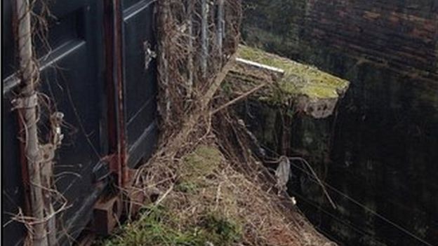 Wall collapse over railway tracks
